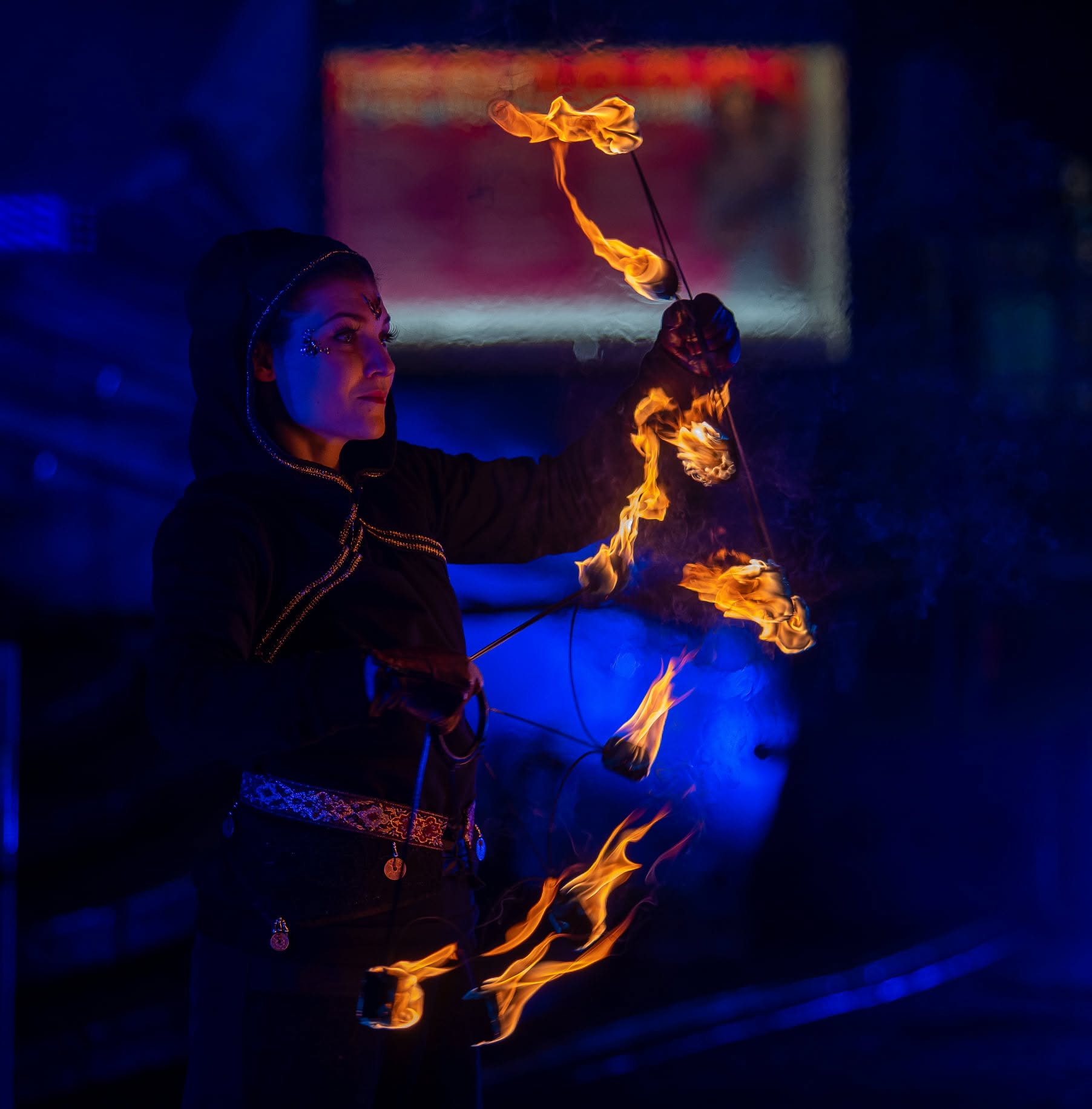 Fire dancer performance at night